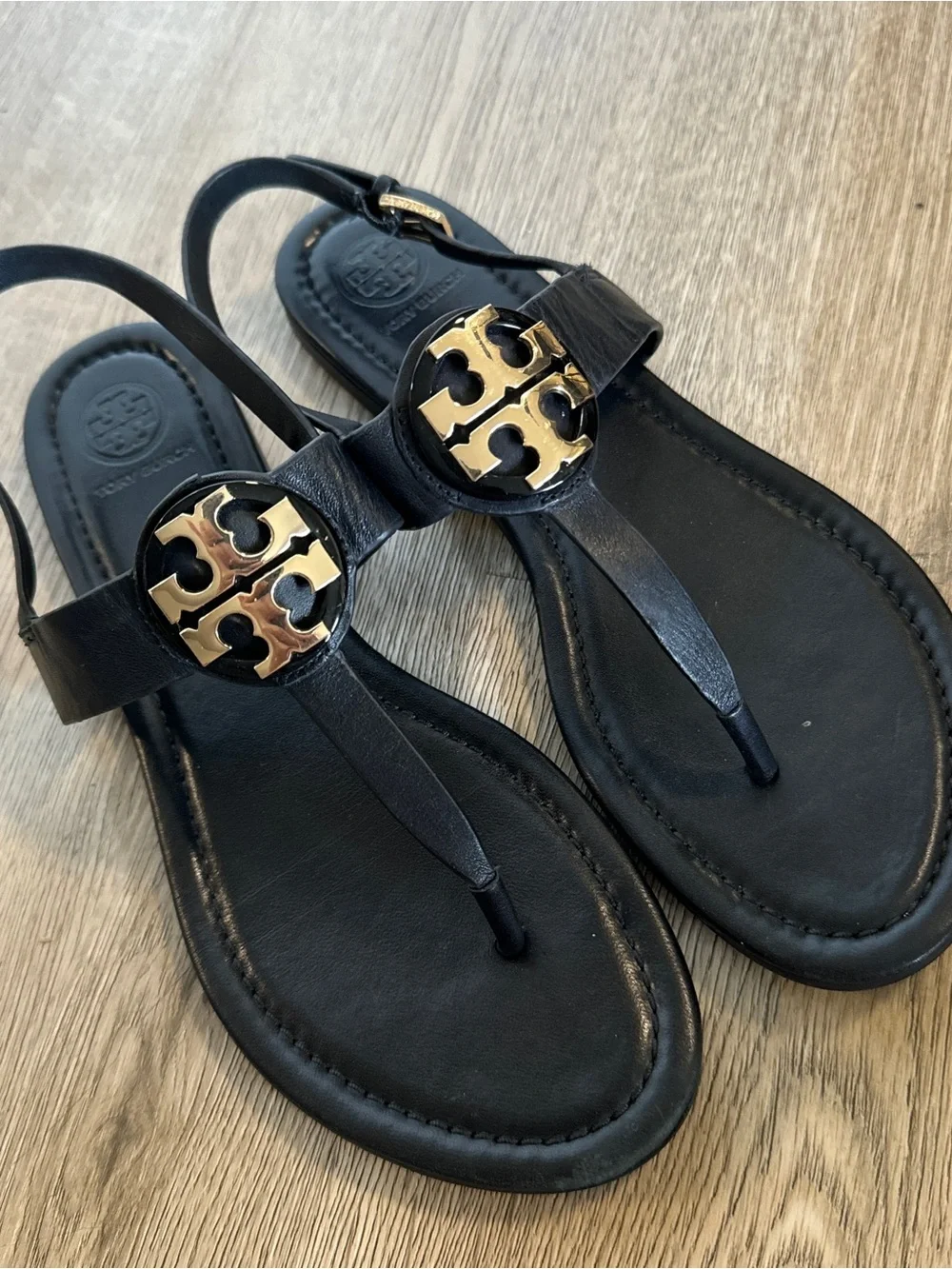 Tory Burch Black Leather T-Strap Sandals with Gold Logo Medallion